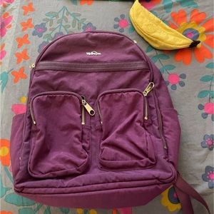 Purple Kipling backpack with banana pencil case